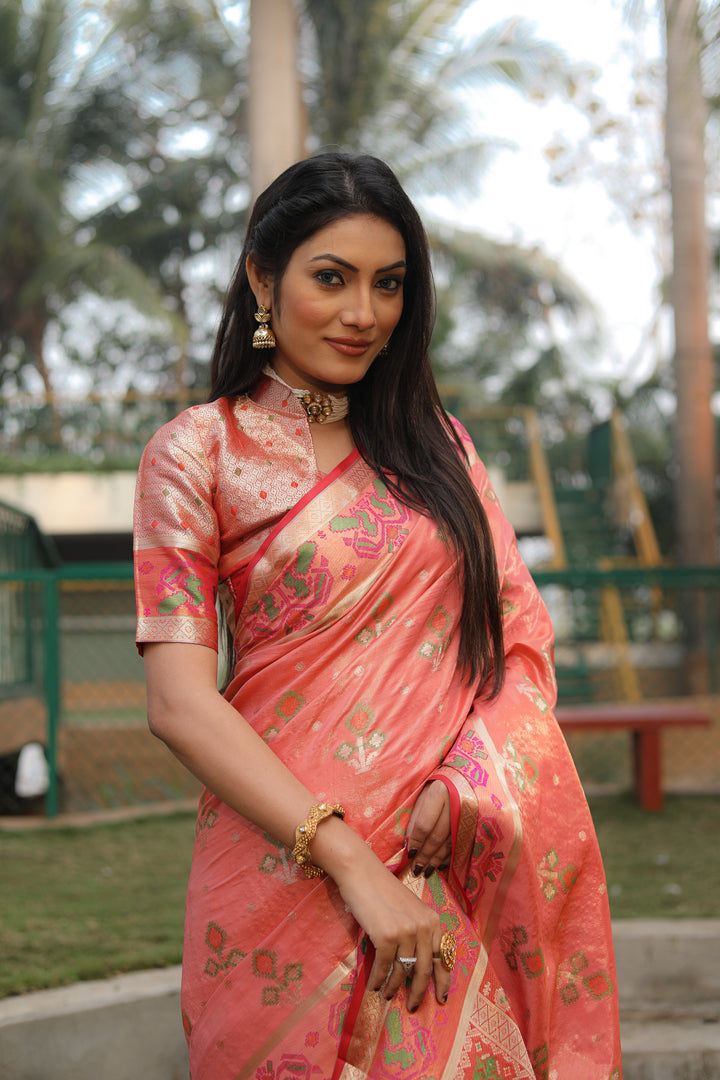 Peach Isha Organza Silk Sarees Ikkat Patola concept With Ikkat Patola weave pallu with tassels