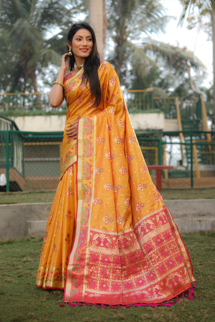 Yellow Isha Organza Silk Sarees Ikkat Patola concept With Ikkat Patola weave pallu with tassels