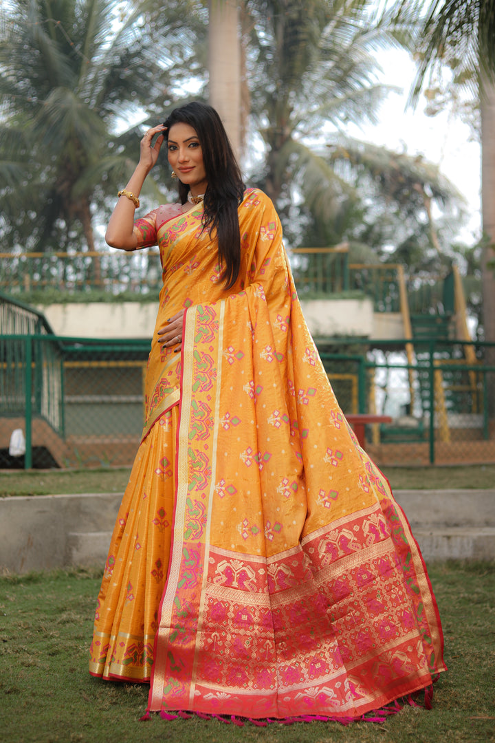 Yellow Isha Organza Silk Sarees Ikkat Patola concept With Ikkat Patola weave pallu with tassels
