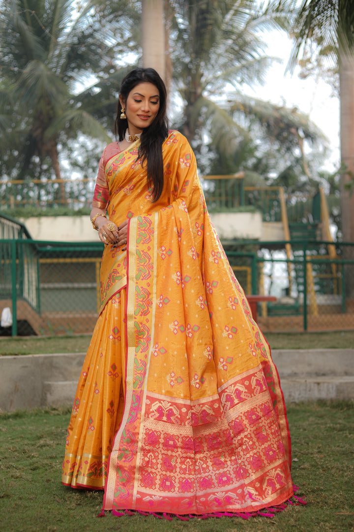 Yellow Isha Organza Silk Sarees Ikkat Patola concept With Ikkat Patola weave pallu with tassels
