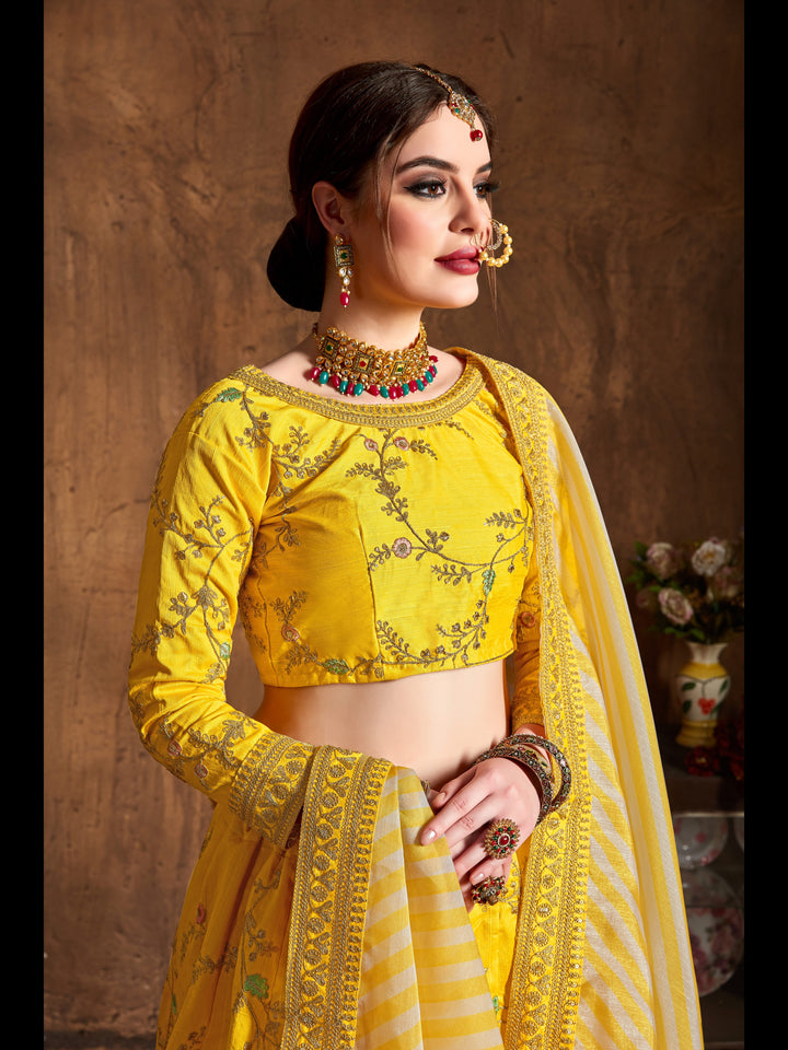 Yellow color Mulberry Silk Zari, Sequins and Embroidery Work Lehenga Choli