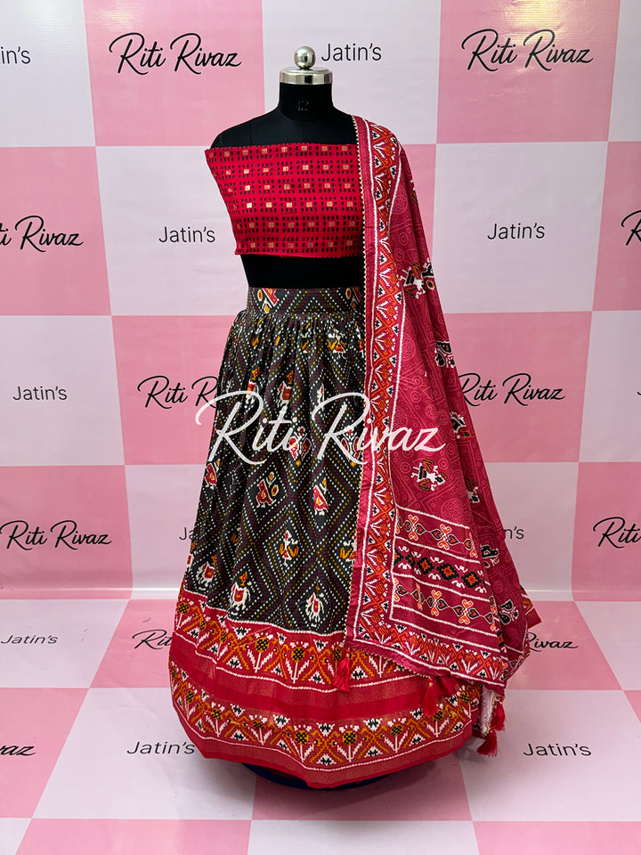 Dark Gray color Tussar Silk Patola and Bandhani Print with foil work Fully Lehenga choli, Patola Print Lehenga